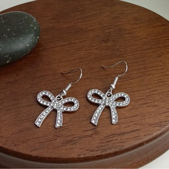 Elegant Silver Tone Bow Earrings - Picture 3 of 3